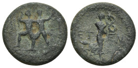 PISIDIA. Etenna. AE 1st century BC (4.82 Gr. 18mm.) 
 Two men standing side by side; the left brandishing double-axe, the right sickle. 
Rev. Nymph ad...