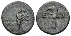 PISIDIA. Etenna. Ae (1st century BC). (3.1 Gr. 16mm.)
Nymph advancing right, head left, holding serpent; vase to left.
 Rev: E - T . Sickle-shaped kni...