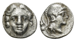 Pisidia, AR Obol Selge 3rd Century BC. (0.87 Gr. 10mm.)
Facing head of Gorgoneion 
Rev. Helmeted head of Athena right, astragal behind
