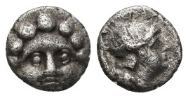 Pisidia, AR Obol Selge 3rd Century BC. ( 1 Gr. 9mm.)
Facing head of Gorgoneion 
Rev. Helmeted head of Athena right, astragal behind