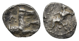 LYCAONIA, Laranda. Circa 324/3 BC. AR Obol (0.54 Gr. 9mm.) 
 Baaltars seated left, holding grain ear, grapes, and scepter 
Rev. Forepart of wolf right...