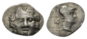 Pisidia, AR Obol Selge 3rd Century BC. ( 0.63Gr. 11mm.)
Facing head of Gorgoneion 
Rev. Helmeted head of Athena right, astragal behind