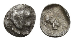 ASIA MINOR. Uncertain. 4th century BC. Tetartemorion.(0.16 Gr. 5mm.)
Uncertain figures. 
 Rev: Head of Athena to left, wearing Corinthian helmet, with...
