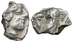 Attica, Athens, c. 454-404 BC. AR Tetradrachm (10.57 Gr. 21 mm.) 
 Helmeted head of Athena right. 
Rev. Owl standing r., head facing; olive sprig behi...