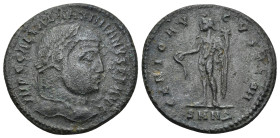 GALERIUS MAXIMIANUS (305-311). Follis. Nicomedia. (6.23 Gr. 27mm.)
Laureate head right.
Rev. Genius standing facing, nude, head left, holding patera a...
