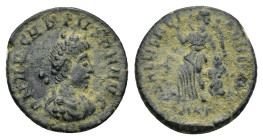Arcadius. AD 383-408. AE. (1.25 Gr. 13mm.). Cyzicus 
Rev. Victory advancing left, head right, dragging captive behind with left hand and holding troph...