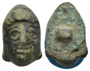 A bronze relief applique in the form of the head. 18mm, 9.23 gr.