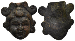 A bronze relief applique in the form of the head. 27mm, 15.85 gr.