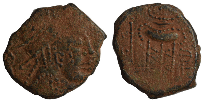 Greek. Ae (bronze, 5.47 g, 23 mm). Bust right. Rev. Decorated tripod, uncertain ...