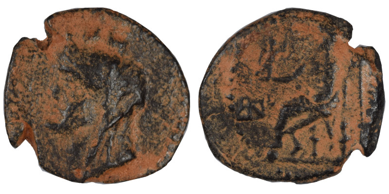 Greek. Ae (bronze, 3.27 g, 19 mm). Bust of Tyche left. Rev. Zeus seated on thron...