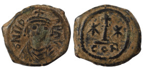 Maurice Tiberius, 582-602. Decanummium (bronze, 3.41 g, 19 mm), Constantinople. D N TIBER P P AV Crowned, draped and cuirassed bust facing. Rev. Large...