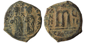 Phocas, with Leontia, 602-610. Follis (bronze, 9.09 g, 27 mm), Theoupolis (Antioch). [D N FOCA N]E PE AV Phocas, crowned holding globus cruciger; to r...