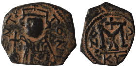 Arab-Byzantine. Circa 661-697. Fals (bronze, 4.76 g, 22 mm). ), imitating a follis of Constans II. EN T૪TO NIKA Bust of Constans II facing, wearing cr...