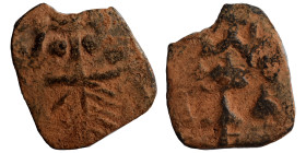 Arab-Byzantine. Circa 645-647. Fals (bronze, 1.05 g, 16 mm), imitating a follis of Constans II, uncertain mint. Bearded head of Constans II facing. Re...