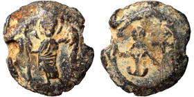 Byzantine lead seal (lead, 5.86 g, 19 mm). Saint standing, facing. Rev. Cruciform monogram. Nearly very fine.
