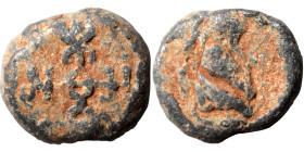 Byzantine lead seal (lead, 11.35 g, 17 mm). Uncertain figure right. Rev. Cruciform monogram. Fine.