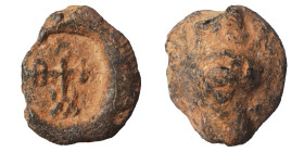 Roman or Byzantine lead seal, circa 5-6th century (lead, 4.97 g, 16 mm). Monogram. Rev. Blank. Nearly very fine.