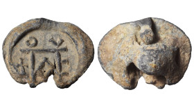 Roman or Byzantine lead seal, circa 5-6th century (lead, 4.15 g, 16 mm). Monogram. Rev. Blank. Nearly very fine.