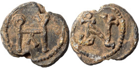 Roman or Byzantine lead seal, circa 5-6th century (lead, 5.58 g, 17 mm). Monogram. Rev. Monogram. Nearly very fine.