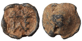 Roman or Byzantine lead seal, circa 5-6th century (lead, 5.18 g, 15 mm). Monogram. Rev. Blank. Nearly very fine.