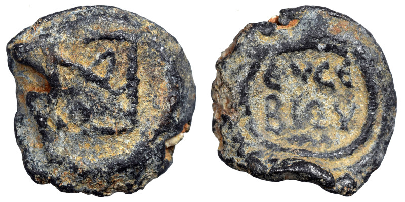 Byzantine lead seal, uncertain (lead, 5.59 g, 17 mm). Monogram. Rev. Inscription...