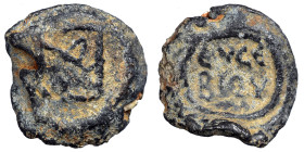 Byzantine lead seal, uncertain (lead, 5.59 g, 17 mm). Monogram. Rev. Inscription in two lines. Nearly very fine.