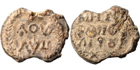 Byzantine lead seal, uncertain (lead, 8.28 g, 22 mm). Inscription in two lines. Rev. Inscription in three lines. Nearly very fine.