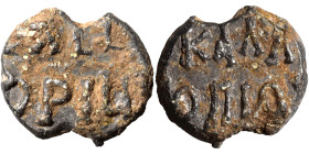 Byzantine lead seal, uncertain (lead, 6.29 g, 18 mm). Inscription in two lines. Rev. Inscription in two lines. Nearly very fine.