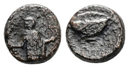 Cyclades, Anaphe. Ae, 2.25 g 10.96 mm. 3rd century BC. 
Obv: Apollo standing facing, holding arrow and bow.
Rev: Skyphos.
Ref: Unpublished in the stan...