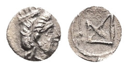 Cyprus, Salamis? AR Tetartemorion, 0.16 g 6.72 mm. Circa 351-332 BC. 
Obv: Turreted head of Aphrodite? right.
Rev: Monogram with caduceus to right wit...