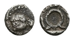 Ionia, Uncertain. AR Tetartemorion, 0.21 g 5.28 mm. 5th century BC. 
Obv.: Head of eagle right.
Rev.: Wreath in incuse square. 
Ref.: SNG Kayhan 1585....
