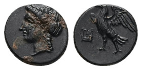 Caria, Halikarnassos. Ae, 1.25 g 11.54 mm. 3rd century BC.
Obv: Head of Apollo left.
Rev.: [ΑΛΙ]; Eagle standing to left, wings open; to left, kithara...