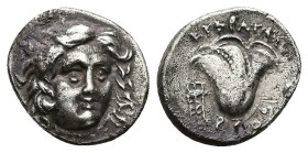 Caria, Rhodes. AR Drachm, 2.69 g 15.43 mm. 229-205 BC. Magistrate: Eukrates. 
Obv: Head of Helios facing slightly right.
Rev.: ΕΥΚΡΑΤΗΣ; Rose with bud...