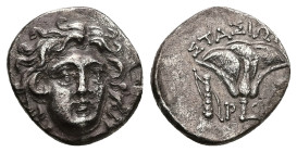 Caria, Rhodes. AR Drachm, 2.65 g 15.27 mm. 205-190 BC. Magistrate: Stasion. 
Obv: Head of Helios facing slightly right.
Rev.: ΣΤΑΣΙΩΝ; Rose with bud t...