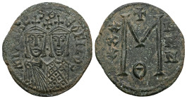 Michael II and Theophilus, AD 820-829. AE, Follis. 7.42 g. 31.58 mm. Constantinople.
Obv: MIXAHL-SΘ-EOFILOS. Michael, with crown and chlamys, short be...