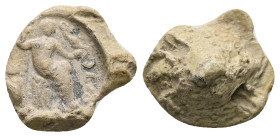 PB Roman conical seal (c. AD 1st–3th centuries).
Obv: Roma seated r., holding a globe, upon which is an eagle with a wreath in its beak; shield at sid...