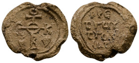 PB Byzantine bilingual seal (c. AD 7th century).
Obv: Cruciform invocative monogram (type V). Two ivy leaves at lower angles. Wreath border.
Rev: In...