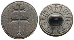 AE Byzantine stamp seal (c. AD 8th–9th centuries).
Obv: A patriarchal cross within border of dots.
Rev: Around the handle, within concentric borders...