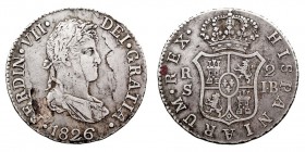 MONARQUÍA ESPAÑOLA FERNANDO VII 2 Reales. AR. Sevilla JB. 1826. 5,81 g. Cal.1034. Hojitas en anv., si no MBC