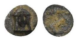 Ionia. Kolophon circa 450-410 BC. Tetartemorion AR (0.19 Gr. 6mm.)
 Facing head of Apollo with long hair 
Rev. Monogram within incuse square.