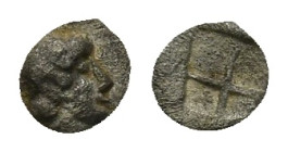 IONIA, Uncertain. Circa 480-450 BC. AR Tetartemorion (0.14 Gr. 5mm.). 
Helmeted male head right 
Rev. Quadripartite incuse square.