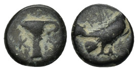 AEOLIS. Kyme. Ae (Circa 320-250 BC). (1.3 Gr. 10mm.)
 Eagle standing right with closed wings.
 Rev: K - Y. One-handled cup.