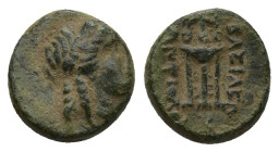 Seleukid Kingdom. Antiochos II Theos. 261-246 B.C. AE (1.5 Gr. 10mm.). Sardes 
 Laureate head of Apollo right 
Rev. Tripod, anchor below, monograms on...
