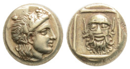 Greek, LESBOS, Mytilene (Circa 377-326 BC) EL Hekte (10.5 mm, 2.55g)
Obv: Wreathed head of Dionysos right.
Rev: Head of satyr facing, with full head o...