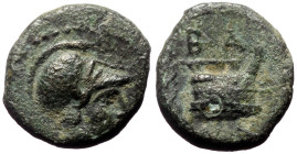 Kings of Macedon, Demetrios I Poliorketes, AE, (Bronze, 1.52 g 11 mm), Circa 306-283 BC. Salamis,
Obv: Helmeted head of Athena right.
Rev: BA, prow ri...
