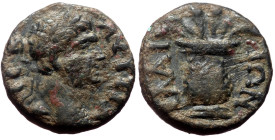 Aeolis, Elaea, Trajan. AE. (Bronze, 2.33 g. 14 mm.) 98-117 AD.
Obv: ΑΥΤ ΤΡΑ ϹƐΒ. Laureate head of Trajan, r.
Rev: ƐΛΑΙΤΩΝ. Basket with two poppies amo...