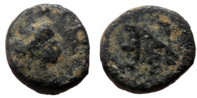 Anastasius I (491-518) AE Nummus (Bronze, 0.55 g, 8mm) Constantinople 
Obv: Diademed bust right; no legend 
Rev: Monogram of Anastasius. 
Ref: DOC I 1...