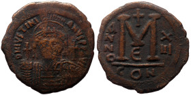 Justinian I (527-565) AE Follis (Bronze, 19.29g, 39mm) Constantinople
Obv: DN IVSTINI-ANVS P[P AVG], helmeted, diademed and cuirassed bust facing, hol...