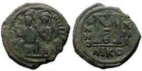 Justin II and Sophia (565-578) AE Follis (Bronze, 13.50g, 30mm) Nikomedia
Obv: D N IVSTI-NVS P P, Justin and Sophia, both nimbate, enthroned facing, J...