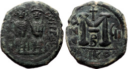 Justin II and Sophia, AE, Follis. (Bronze, 13.15 g. 28 mm.) Nicomedia. 565-578 AD.
Obv: DN IVSTI[NVS PP] AV[G], Justin II and Sophia nimbate and seate...